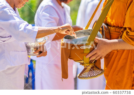 The monks of the Buddhist Sangha(give alms to a 60337738