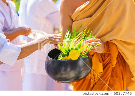The monks of the Buddhist Sangha(give alms to a 60337746