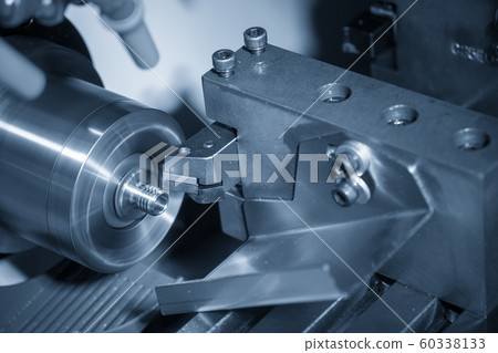 The CNC lathe machine in metal working process. The CNC lathe machine in metal working process. 60338133