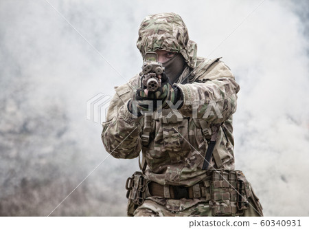 army soldier attacking enemies trough smoke screen army soldier attacking enemies trough smoke screen 60340931