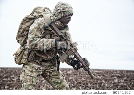 Portrait of modern army infantryman on march 60341162