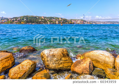 Bosphorus coast stones, the Sultan Fatih Mehmet Bridge and the Rumeli Hisari in the background Bosphorus coast stones, the Sultan Fatih Mehmet Bridge and the Rumeli Hisari in the background 60343959