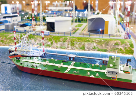 Miniature model of tanker ship and layout of oil Miniature model of tanker ship and layout of oil 60345165