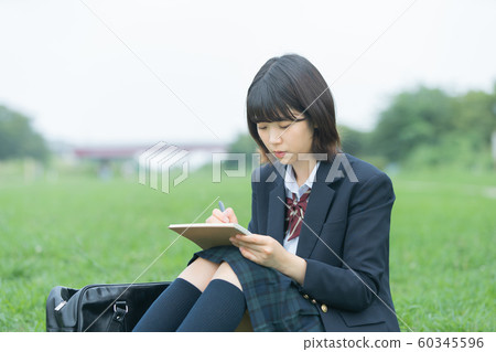 High school girl studying outdoors 60345596