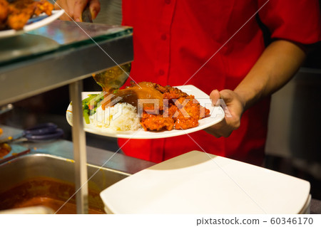 Vendor Pouring Gravy On Rice In Plate At Market Stall 60346170