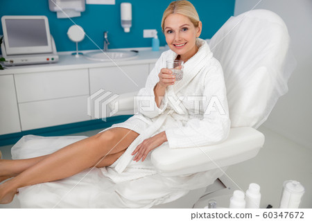 Happy pretty woman spending time in beauty salon Happy pretty woman spending time in beauty salon 60347672