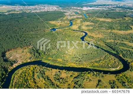 Aerial View Green Forest Woods And River Landscape In Sunny Summer Day. Top View Of Beautiful European Nature From High Attitude In Summer Season. Drone View. Bird's Eye View Aerial View Green Forest Woods And River Landscape In Sunny Summer Day. Top View Of Beautiful European Nature From High Attitude In Summer Season. Drone View. Bird's Eye View 60347676