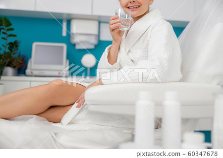 Happy adult lady relaxing in beauty salon Happy adult lady relaxing in beauty salon 60347678