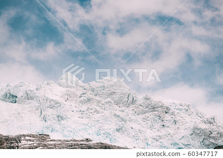 Jostedalsbreen National Park, Norway. Close Up View Of Melting Ice And Snow On Boyabreen Glacier In Summer Sunny Day. Famous Norwegian Landmark And Popular Destination. Close Up 60347717
