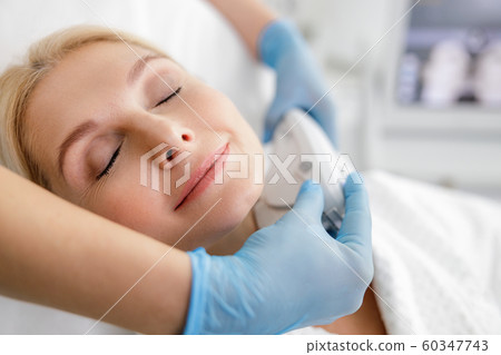 Beautiful adult woman is having lifting procedure 60347743