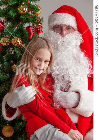 Girl on Santa Claus knees Girl on Santa Claus knees 60347796