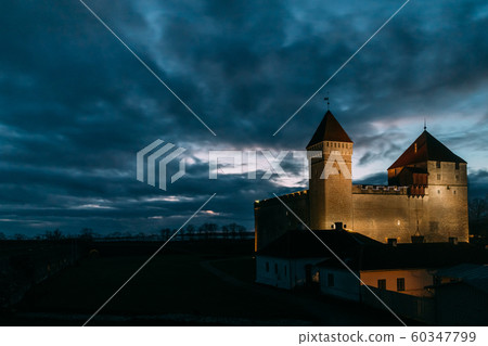 Kuressaare, Saaremaa Island, Western Estonia. Episcopal Castle In Night Lights. Traditional Medieval Architecture, Famous Attraction Landmark. Castle In Night Lighting Kuressaare, Saaremaa Island, Western Estonia. Episcopal Castle In Night Lights. Traditional Medieval Architecture, Famous Attraction Landmark. Castle In Night Lighting 60347799