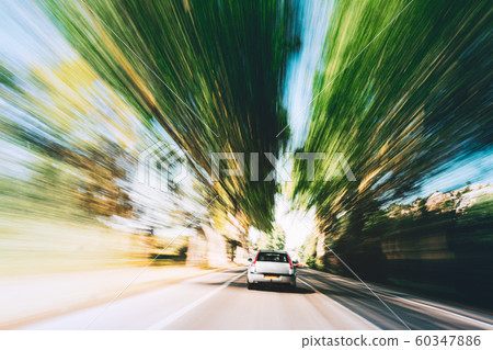 Speeding Car On A Highway, Country Asphalt Road. Motion Blur Background. Dangerous Drive Speeding Car On A Highway, Country Asphalt Road. Motion Blur Background. Dangerous Drive 60347886