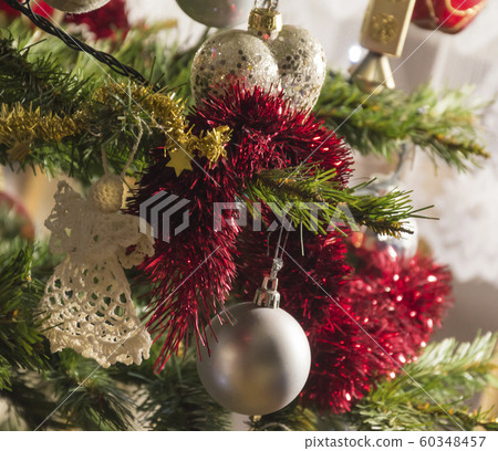 Christmas ornaments on a pine tree background. Christmas ornaments on a pine tree background. 60348457