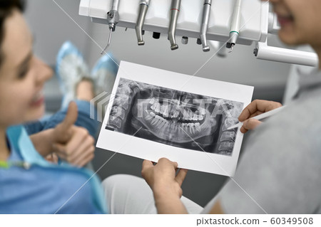 Pretty woman's teeth treatment in dental clinic 60349508