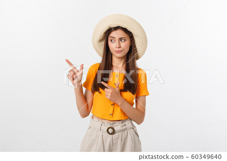 young pretty woman looking unhappy and stressed, suicide gesture making gun sign with hand, pointing to copy space. 60349640