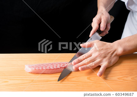 In front of the board to pull the sashimi In front of the board to pull the sashimi 60349687