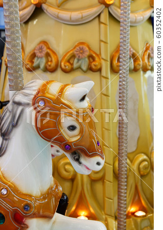 head of a wooden horse on a vintage merry-go-round 60352402