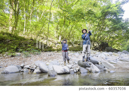 Mountain stream fishing image Parent and child family 60357036