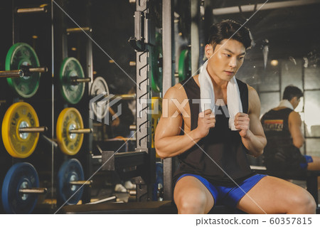 Male and female exercising in gym. Sport, fitness, weightlifting and training concept 473 60357815