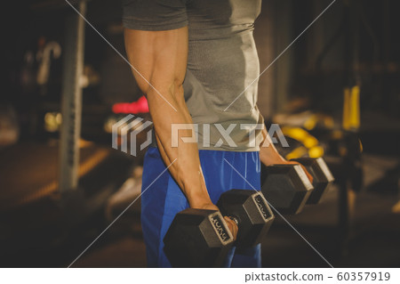 Male and female exercising in gym. Sport, fitness, weightlifting and training concept 387 60357919