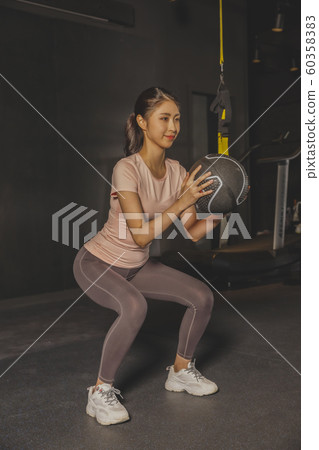 Male and female exercising in gym. Sport, fitness, weightlifting and training concept 230 60358383