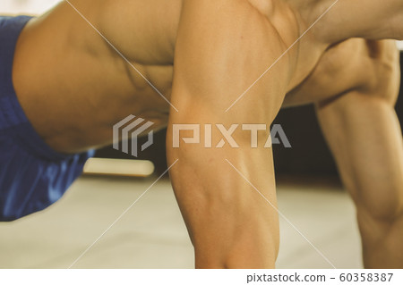 Male and female exercising in gym. Sport, fitness, weightlifting and training concept 130 60358387