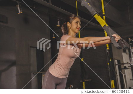 Male and female exercising in gym. Sport, fitness, weightlifting and training concept 201 60358411