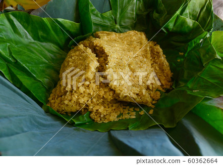 Dried rice with green leaves 60362664
