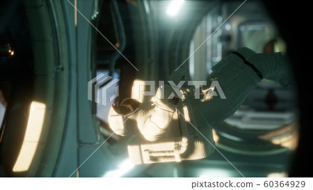 astronaut inside the orbital space station 60364929