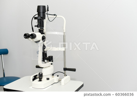 Ophthalmoscopy of the eye. Medical equipment with ophthalmoscope in modern clinic Ophthalmoscopy of the eye. Medical equipment with ophthalmoscope in modern clinic 60366036