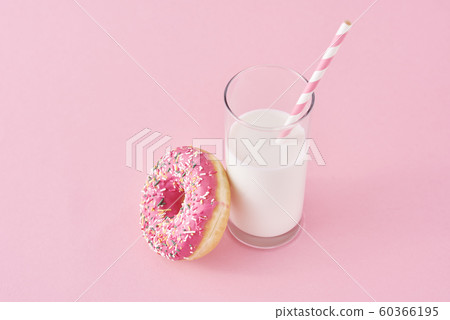 Donuts with glass of milk on a pink background Donuts with glass of milk on a pink background 60366195