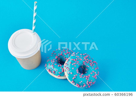 Cup of coffee and donuts on a blue background Cup of coffee and donuts on a blue background 60366196