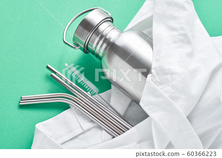 Aluminum bottle and metal tubes in a shopping bag Aluminum bottle and metal tubes in a shopping bag 60366223