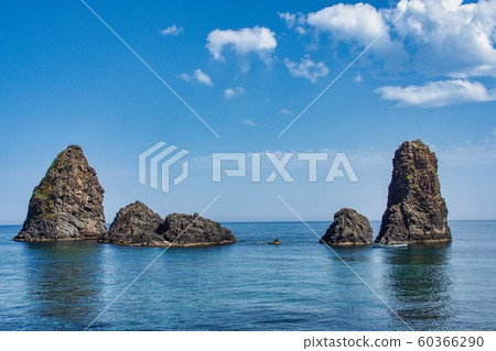 Cyclops island, basaltic rock fomation in Aci Trezza, Catania, Sicily, Italy. Cyclops island, basaltic rock fomation in Aci Trezza, Catania, Sicily, Italy. 60366290