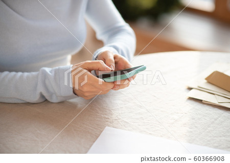Close up of womans hands holding smartphone Close up of womans hands holding smartphone 60366908