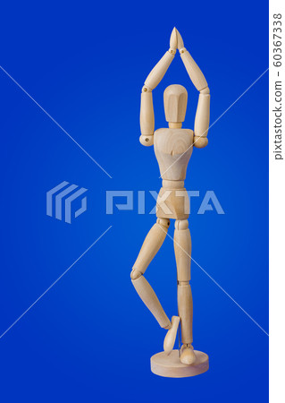 Dancing wooden toy figure on blue Dancing wooden toy figure on blue 60367338