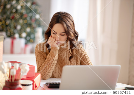 Young pretty woman with long hair thinking about her work 60367431