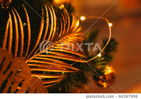 Golden tropical leaves. 60367998