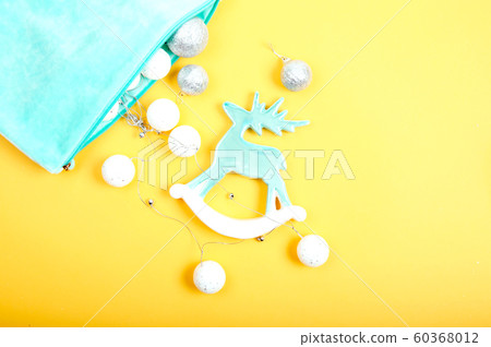 Toy pastel blue deer with Christmas garland 60368012