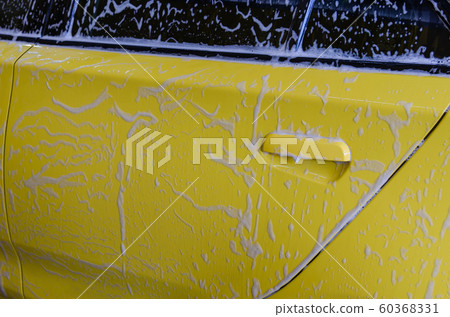 yellow car with foam. 60368331