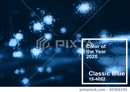 Main color trend 2020 classic blue. night city with blurred lights from cars and flashlights through glass Main color trend 2020 classic blue. night city with blurred lights from cars and flashlights through glass 60368399