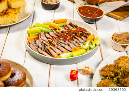 Selection of traditional hanukkah food for festive dinner, wood background 60368503
