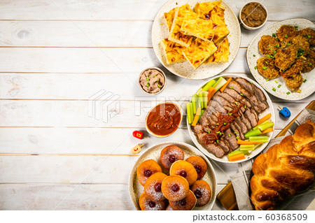 Selection of traditional hanukkah food for festive dinner, wood background Selection of traditional hanukkah food for festive dinner, wood background 60368509