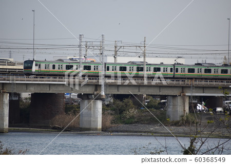 JR East E233 series Tokaido Line crossing the Sagami River 60368549