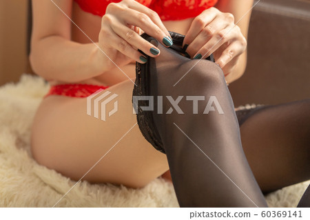 woman dressing stockings 60369141