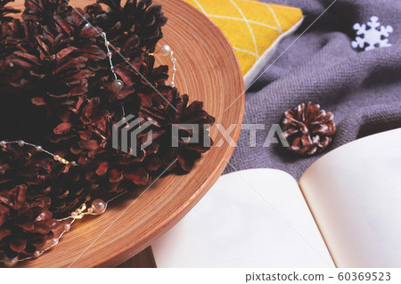 Christmas warm flat lay with cones, book. 60369523