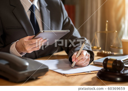 Judge gavel with Justice lawyers, Consultation of Businessman or lawyer team meeting with client in office, Law and Legal services concept. Judge gavel with Justice lawyers, Consultation of Businessman or lawyer team meeting with client in office, Law and Legal services concept. 60369659