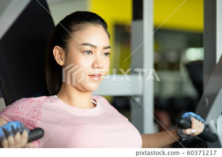 Female fitness rowing Female fitness rowing 60371217
