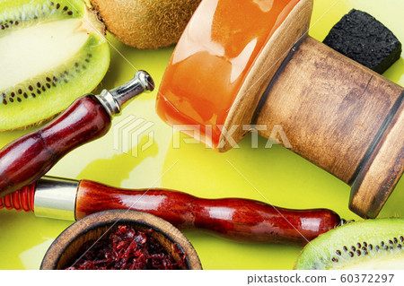 Fragrant smoking hookah with kiwi Fragrant smoking hookah with kiwi 60372297